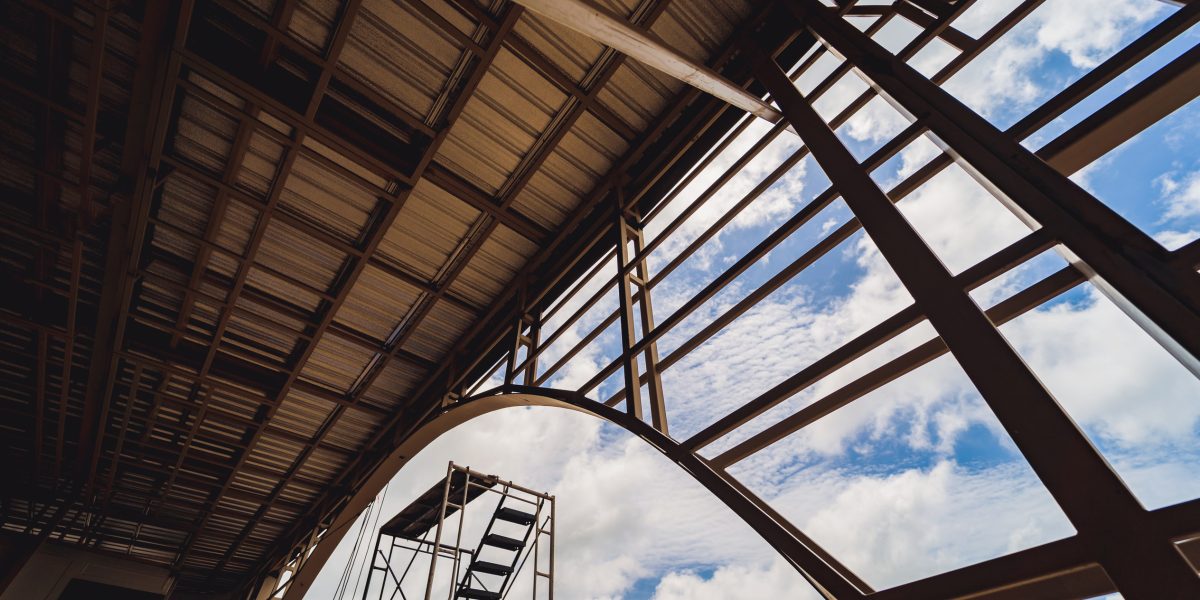 A structure featuring wooden slats on construction site contributing to its architectural style.